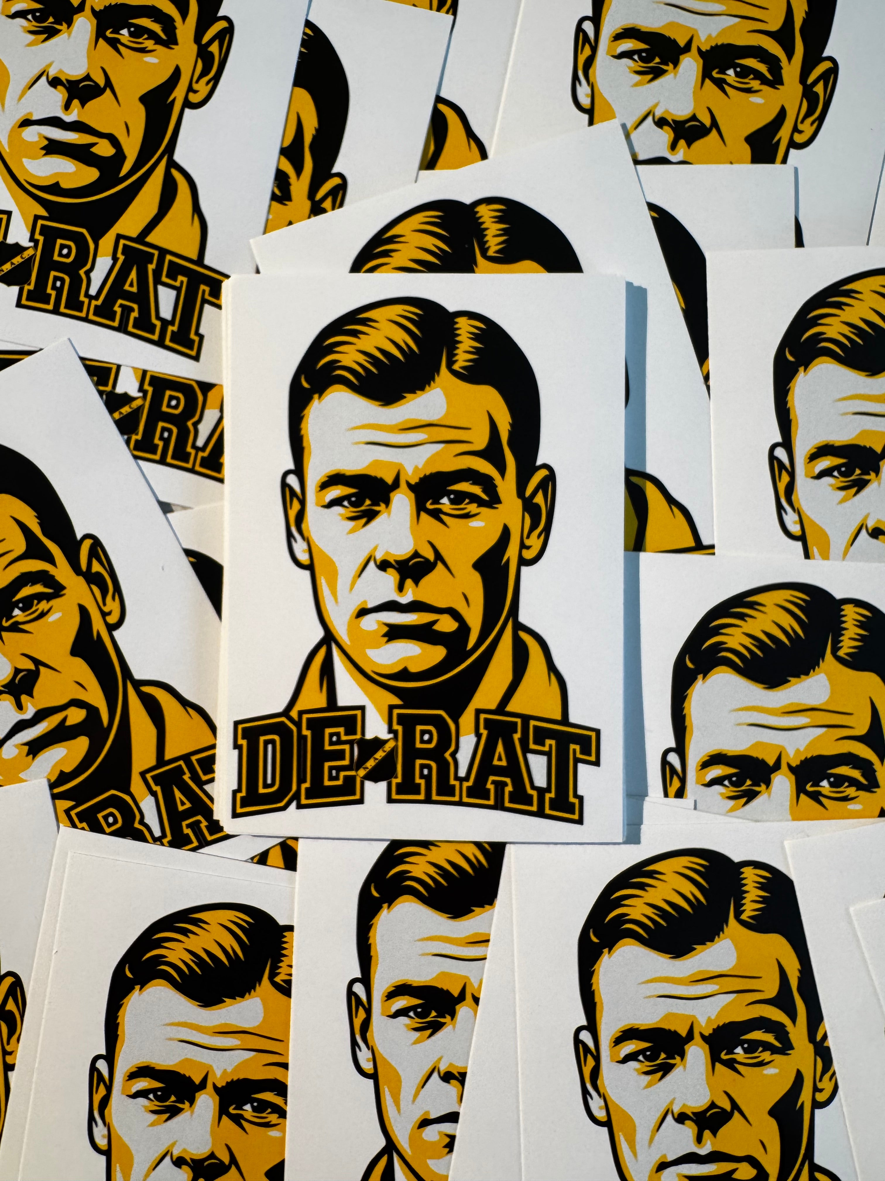 Meerdere Rat Verlegh-stickers van NACsfeer naast elkaar