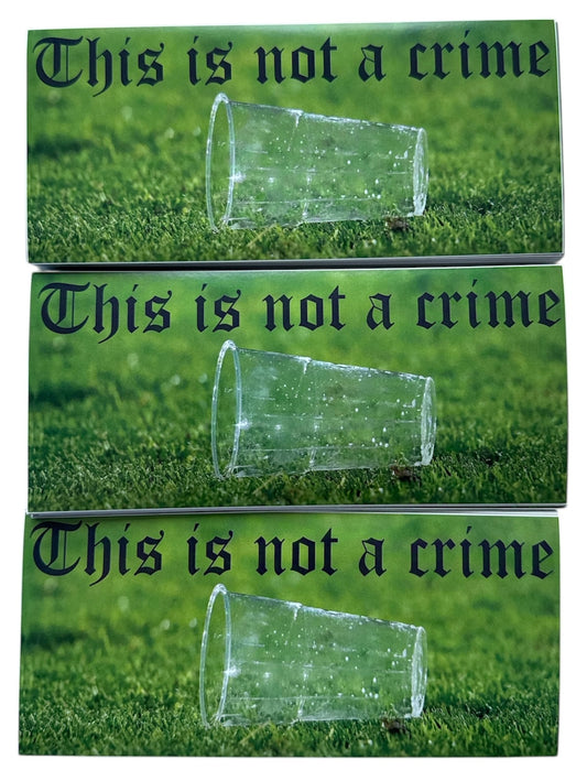 langwerpige sticker, op de sticker staat een foto van een lege beker die op het voetbalveld ligt met als tekst erbij this is not a crime.