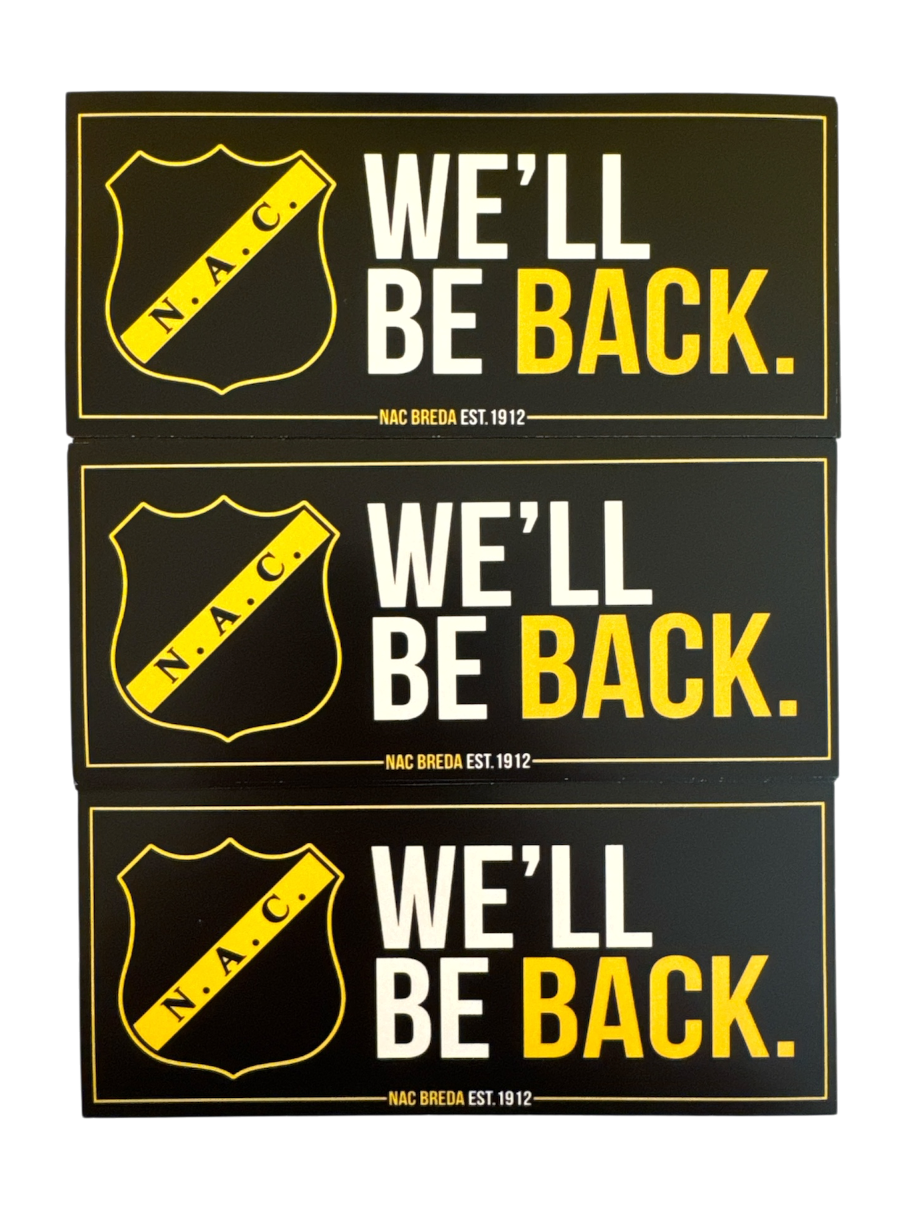 Stapel van drie zwarte en gele NAC Breda stickers met de tekst 'We'll be back', het officiële clublogo en NAC Breda est. 1912.