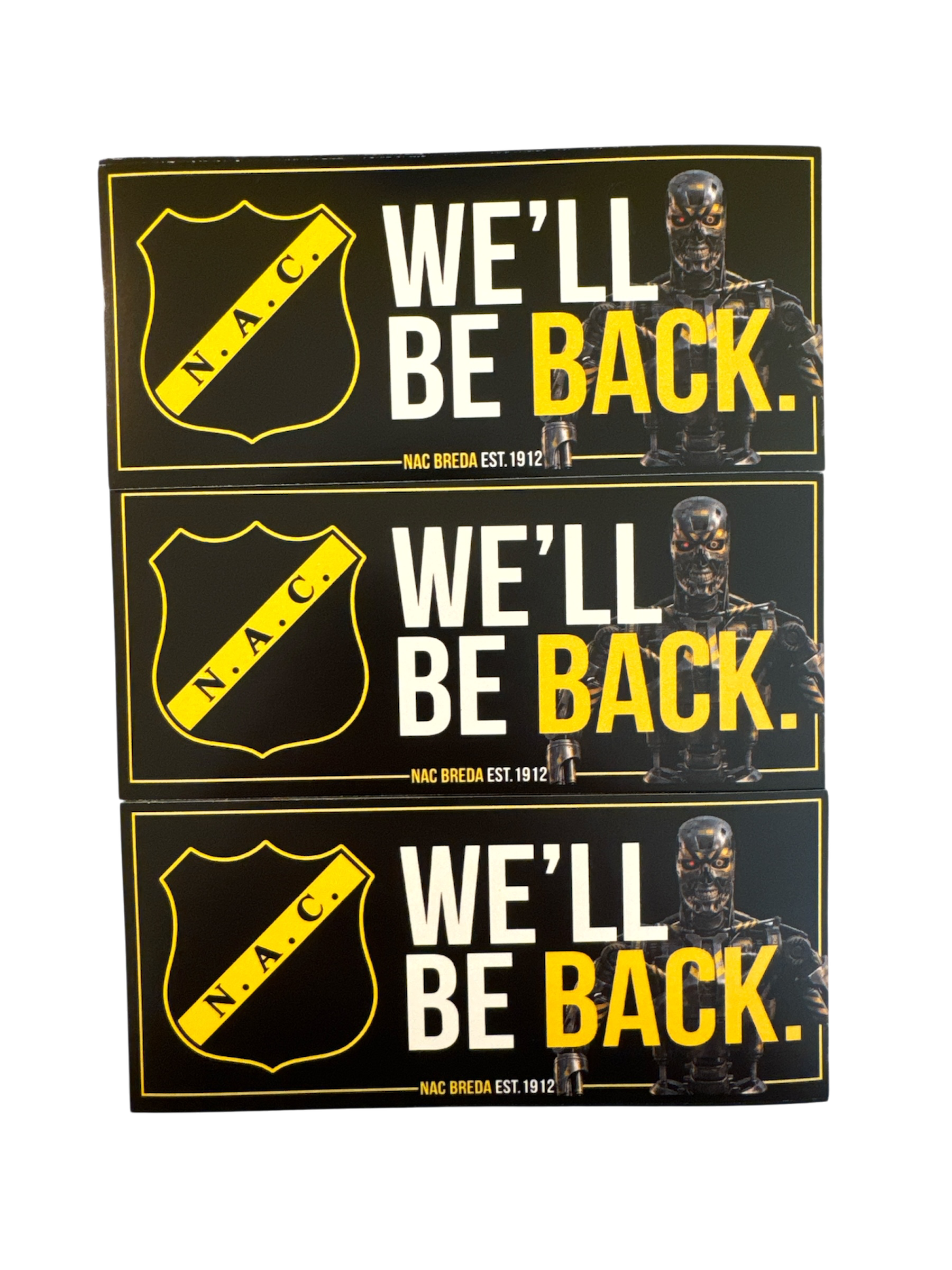 Stapel van drie zwarte en gele NAC Breda stickers met de tekst 'We'll be back', het officiële clublogo, NAC Breda est. 1912 en een Terminator-illustratie.